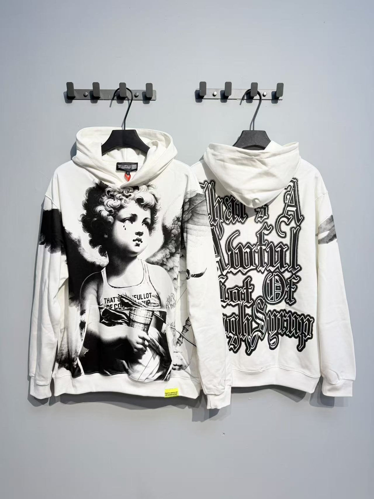 THAT'S A AWFUL LOT OF COUGH SYRUP Angel Graphic Hoodie — context