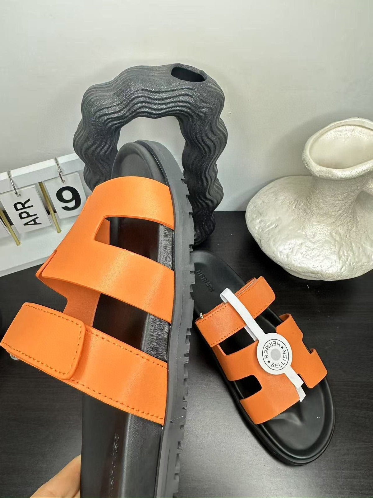 Hermès Orange Interwoven Slide Sandals — model
