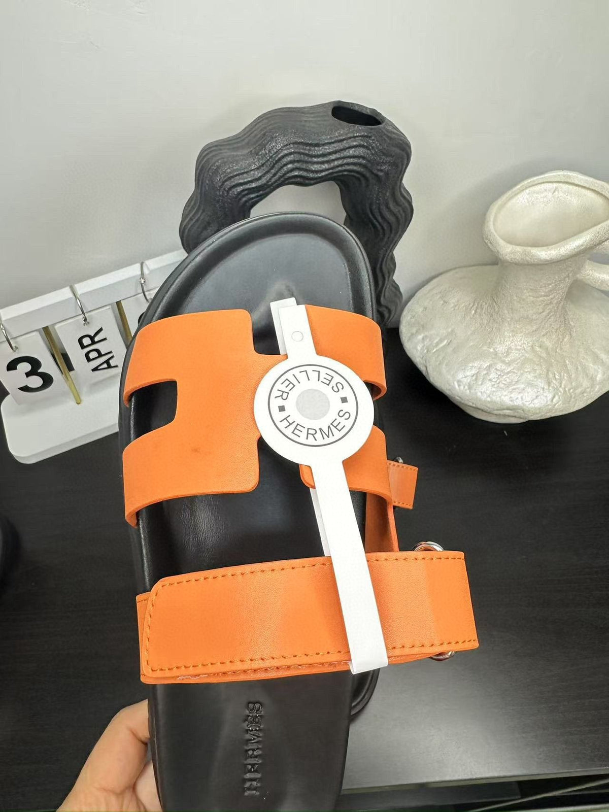 Hermès Orange Interwoven Slide Sandals — model