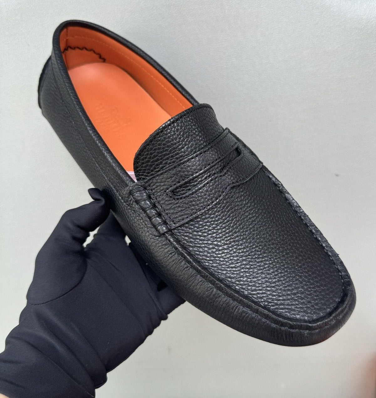 Hermès Black Textured Penny Loafers — model