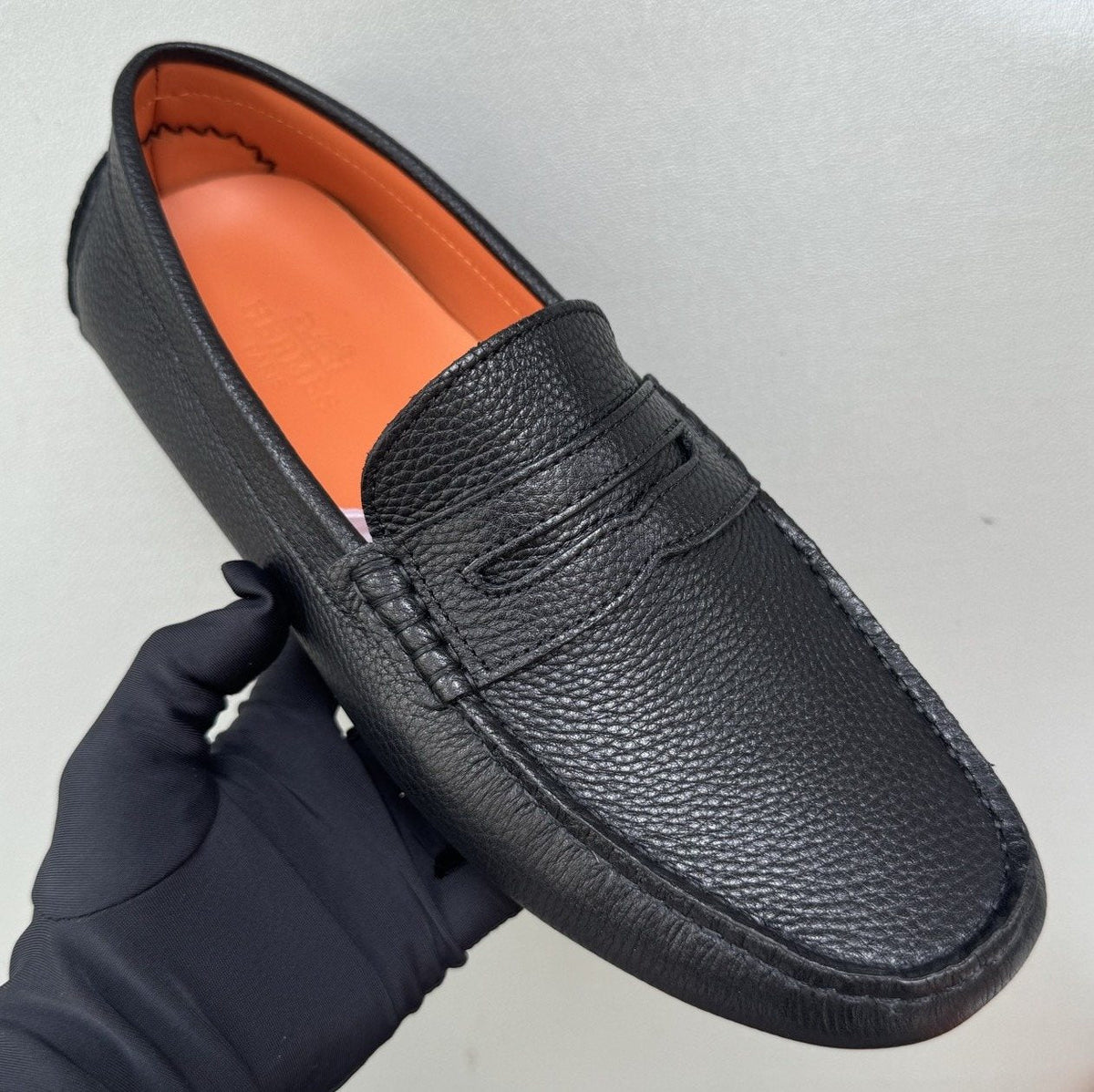 Hermès Black Textured Penny Loafers — hero