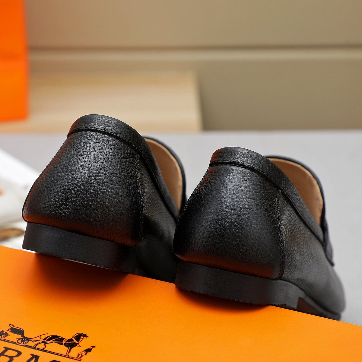 Hermès Black Pebbled Leather H-Hardware Loafers — back