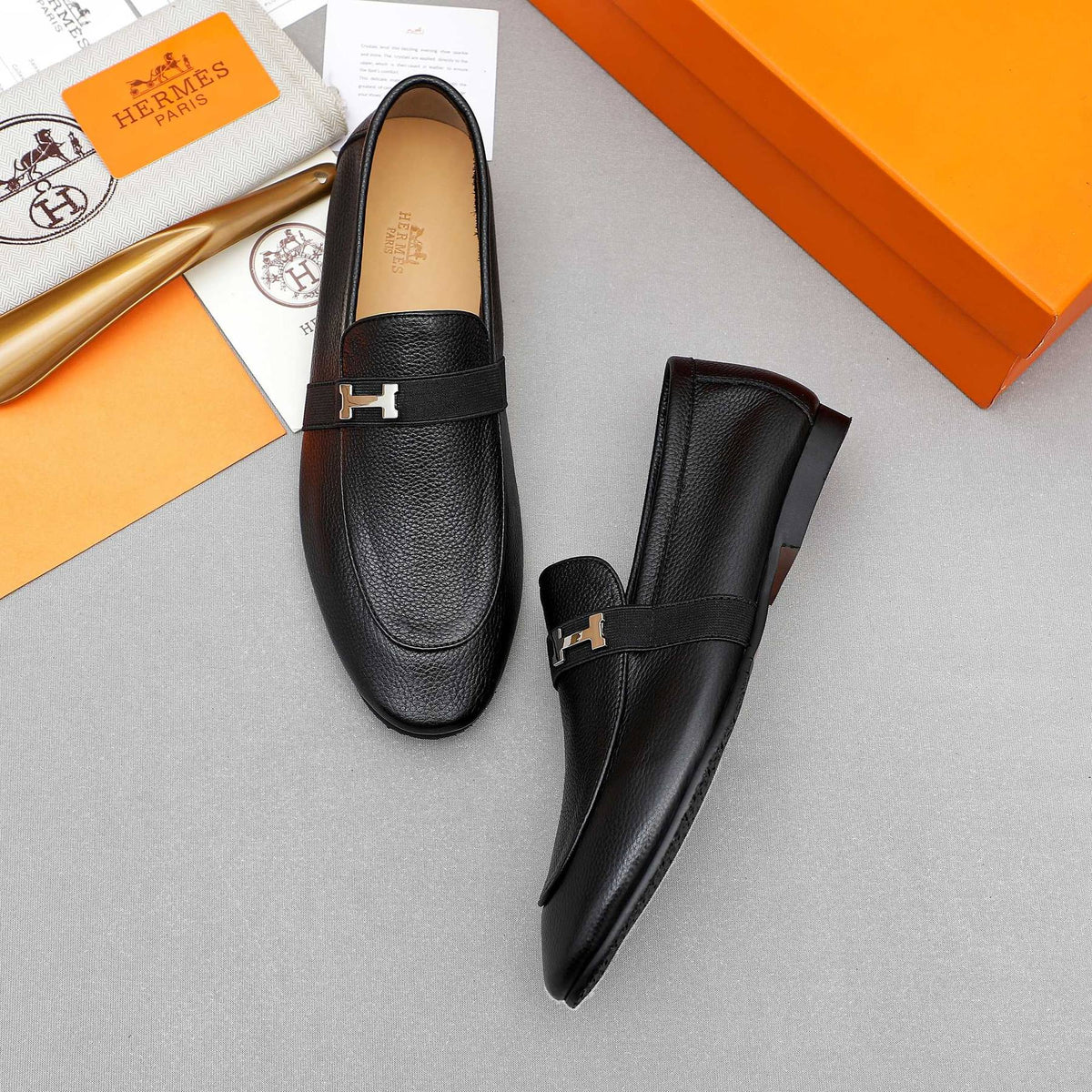 Hermès Black Pebbled Leather H-Hardware Loafers — front