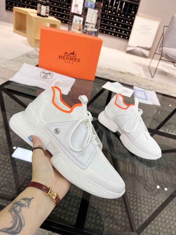 Hermès White Orange Knit Sneakers — model