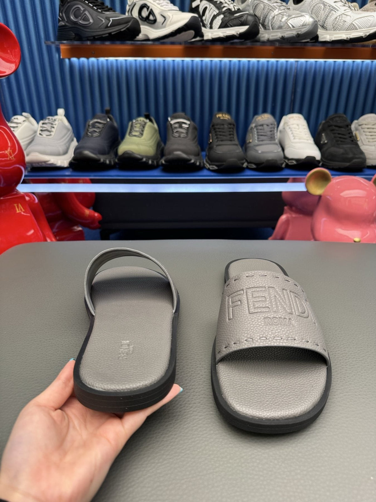 Fendi Embossed Logo Slide Sandals — side