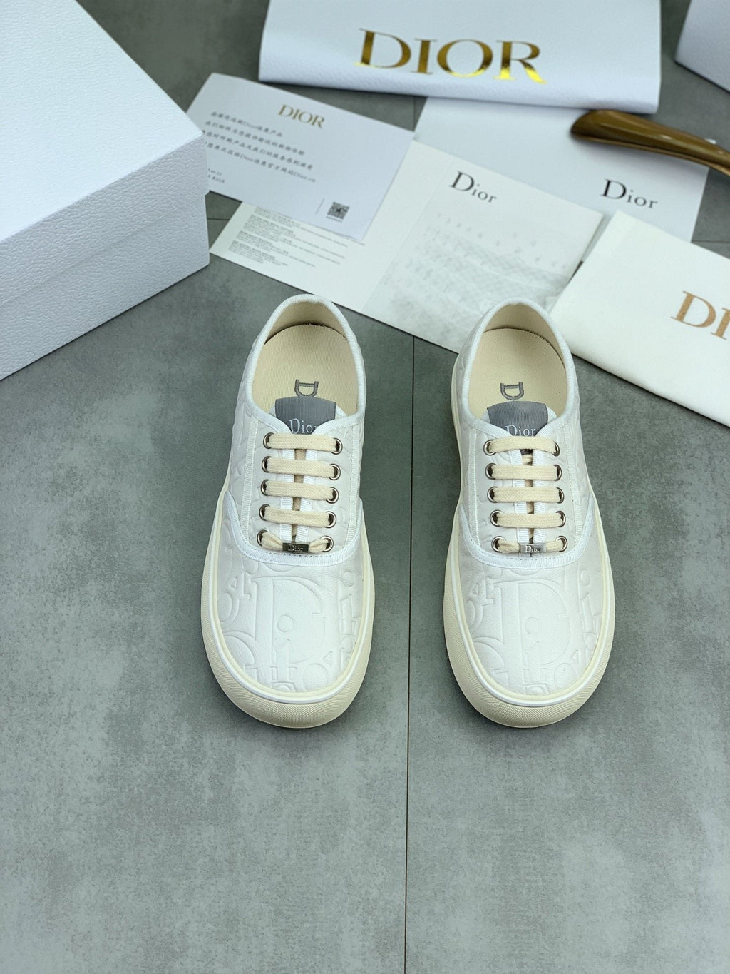 Dior White Embossed Low-Top Sneakers — hero